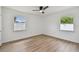Inviting bedroom featuring neutral walls, modern flooring, and plenty of natural light at 1484 Patricia St, Kissimmee, FL 34744