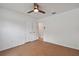 Neutral bedroom featuring a ceiling fan, tile flooring, and ample closet space at 1484 Patricia St, Kissimmee, FL 34744