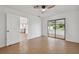 Bright bedroom features neutral paint, ceiling fan, and sliding doors to sunroom at 1484 Patricia St, Kissimmee, FL 34744