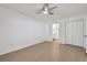 Cozy bedroom boasts neutral walls, tile floors, and a ceiling fan at 1484 Patricia St, Kissimmee, FL 34744