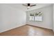 Bright bedroom with a ceiling fan, tile floors, and a large window at 1484 Patricia St, Kissimmee, FL 34744