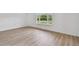Clean and vacant bedroom with wood flooring and natural light at 1484 Patricia St, Kissimmee, FL 34744