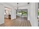 Dining area with modern chandelier and sliding door access to the enclosed lanai at 1484 Patricia St, Kissimmee, FL 34744