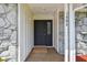 Inviting front entry showcasing stone accents and clear house numbers for easy identification at 1484 Patricia St, Kissimmee, FL 34744