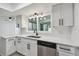Modern kitchen with stainless steel appliances, white cabinets, and sleek countertops at 1484 Patricia St, Kissimmee, FL 34744