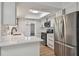 Bright, renovated kitchen featuring stainless steel appliances, white cabinets, and modern countertops at 1484 Patricia St, Kissimmee, FL 34744