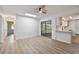 Light-filled living room featuring modern flooring and access to a screened lanai at 1484 Patricia St, Kissimmee, FL 34744