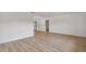 Clean and vacant living room with wood flooring and neutral paint at 1484 Patricia St, Kissimmee, FL 34744