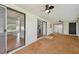 Enclosed sunroom featuring sliding glass doors to the patio and kitchen at 1484 Patricia St, Kissimmee, FL 34744