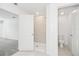 Bright bathroom showcasing an open shower with neutral tile and a toilet in a separate space at 1533 Peach Creek Dr, Osteen, FL 32764