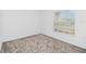 Bedroom with carpet, a large window, and a neutral color palette at 1533 Peach Creek Dr, Osteen, FL 32764
