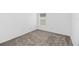 Simple bedroom with neutral carpet and a window providing natural light at 1533 Peach Creek Dr, Osteen, FL 32764