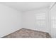 Bedroom featuring a carpeted floor, closet, and a window for natural light at 1533 Peach Creek Dr, Osteen, FL 32764