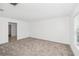 Neutral bedroom featuring soft carpet and a sunlit window at 1533 Peach Creek Dr, Osteen, FL 32764
