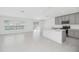 Modern kitchen with stainless steel appliances, quartz countertops, island, and ample cabinet space at 1533 Peach Creek Dr, Osteen, FL 32764
