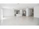 Bright, open-concept living and kitchen area with tile flooring and abundant natural light at 1533 Peach Creek Dr, Osteen, FL 32764