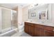 Bathroom featuring a glass shower, double sink vanity, and neutral tones, creating a serene atmosphere at 1625 Smokey Oak Way, Longwood, FL 32750