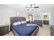Comfortable bedroom featuring a king-sized bed, ceiling fan, and ample space, perfect for relaxation at 1625 Smokey Oak Way, Longwood, FL 32750