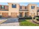 Inviting townhome with attached garages, neutral paint, a well-maintained lawn, and a welcoming entrance at 1625 Smokey Oak Way, Longwood, FL 32750