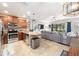 A view of the open concept living space with tile floors, and kitchen with a view to the backyard at 1625 Smokey Oak Way, Longwood, FL 32750