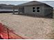 View of the exterior elevation of the home in the back yard at 1667 Meadowlark Dr, Deltona, FL 32725