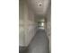 Spacious hallway with neutral walls leads to other rooms in this unfinished home at 1667 Meadowlark Dr, Deltona, FL 32725