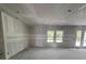 Unfinished laundry room awaits customization with utility hookups and neutral walls at 1667 Meadowlark Dr, Deltona, FL 32725