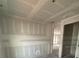 Spacious living room with drywall ready for finishing touches and ample natural light at 1667 Meadowlark Dr, Deltona, FL 32725
