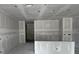 Open-concept living area with neutral walls and ample space for entertaining at 1667 Meadowlark Dr, Deltona, FL 32725