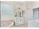 Bright bathroom with soaking tub, double vanity, sleek hardware, and lots of natural light at 1679 Shadowmoss Cir, Lake Mary, FL 32746