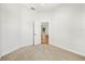Neutral bedroom with open door and view to the living room and front yard at 1679 Shadowmoss Cir, Lake Mary, FL 32746
