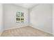 The carpeted bedroom has a window with plantation shutters for natural light and privacy at 1679 Shadowmoss Cir, Lake Mary, FL 32746