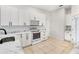 Updated kitchen with white cabinets, marble countertops, and stainless steel appliances at 1679 Shadowmoss Cir, Lake Mary, FL 32746