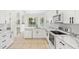Modern kitchen features white cabinets, marble countertops, and stainless steel appliances at 1679 Shadowmoss Cir, Lake Mary, FL 32746