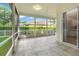 Bright lanai featuring neutral tiles and views of the backyard at 1679 Shadowmoss Cir, Lake Mary, FL 32746
