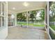 Large screened lanai offers an outdoor space with views of the green backyard at 1679 Shadowmoss Cir, Lake Mary, FL 32746