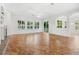 Bright living room with tile floors, many windows, and a fireplace at 1679 Shadowmoss Cir, Lake Mary, FL 32746