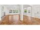 Spacious living room featuring tile floors, white walls, and large windows at 1679 Shadowmoss Cir, Lake Mary, FL 32746