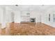 Open-concept living area featuring a fireplace, tile floors, and neutral decor at 1679 Shadowmoss Cir, Lake Mary, FL 32746