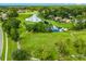 Scenic aerial view of community pond and surrounding landscaping creating a tranquil outdoor space at 1679 Shadowmoss Cir, Lake Mary, FL 32746