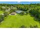 Aerial view of community tennis courts with nearby recreation area and green lawn at 1679 Shadowmoss Cir, Lake Mary, FL 32746