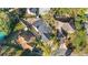 Birds eye view displays backyard layouts, fencing, landscaping, and the arrangement of nearby homes at 17 Hibiscus Ct, Eustis, FL 32726