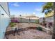 Private backyard featuring brick pavers, flowering plants, and a small seating area at 17 Hibiscus Ct, Eustis, FL 32726