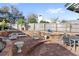 Spacious brick patio with seating, flower beds, and a tranquil outdoor setting at 17 Hibiscus Ct, Eustis, FL 32726