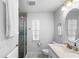 Bathroom with white vanity, frameless glass shower, and modern fixtures at 17 Hibiscus Ct, Eustis, FL 32726