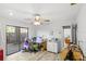 Craft room features a large sliding glass door, wood-look floors, and an attached room at 17 Hibiscus Ct, Eustis, FL 32726