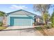 Charming single-story home featuring a two-car garage and well-maintained front yard at 17 Hibiscus Ct, Eustis, FL 32726