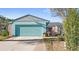 Charming single-story home featuring a two-car garage and well-maintained front yard at 17 Hibiscus Ct, Eustis, FL 32726