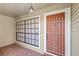 Welcoming covered front porch and security door at 17 Hibiscus Ct, Eustis, FL 32726