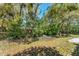 Landscaped backyard with mature trees at 17 Lawn St, Oviedo, FL 32765